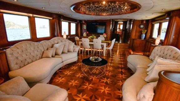 Among Göcek yacht charter options the 5 cabin 10 guest River Storm motor yacht features a spacious saloon with wooden in