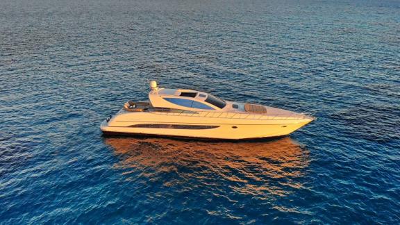 Sea U motor yacht anchored off Athens at sunset.