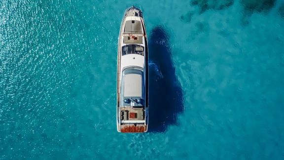 Sea Ya is captured from above in the bays of Athens, showcasing crystal clear waters and private yacht charter appeal.