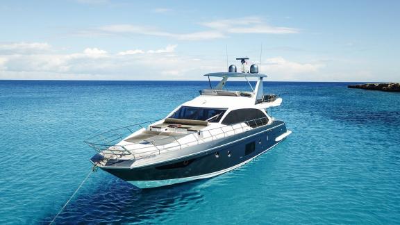 Sea Ya is anchored in the turquoise waters near Athens, creating an elegant setting for luxury yacht charter.