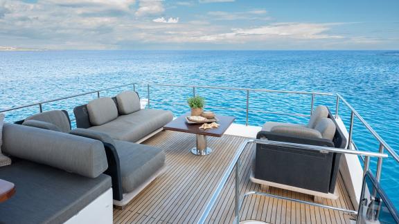 Sea Ya features a comfortable aft deck lounge with panoramic sea views for relaxing moments while cruising Athens.