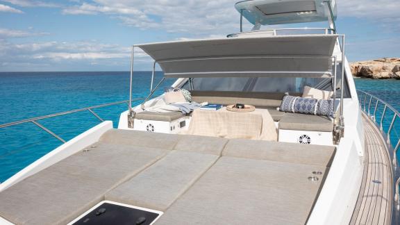 Sea Ya features a foredeck lounge with sun pads and seating, perfect for relaxing while cruising near Athens.