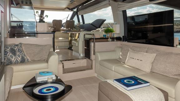 Sea Ya features a bright main saloon and helm station, offering a comfortable private yacht charter experience.