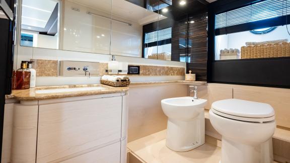 Sea Ya features a modern guest bathroom with elegant finishes, enhancing the luxury yacht charter experience.