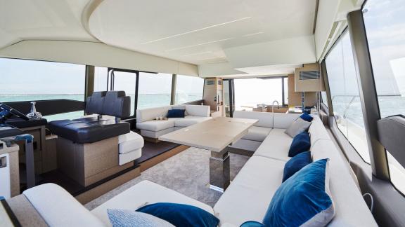 The spacious and modern interior of the motor yacht Shaft features large seating areas and contemporary design.