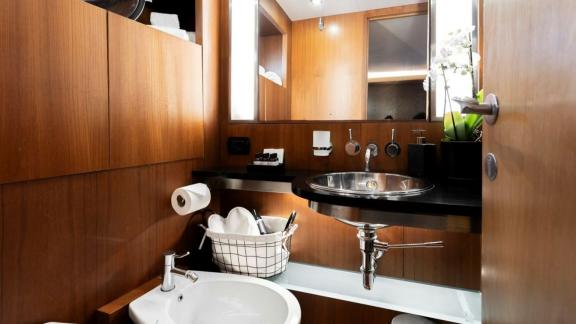 Among motor yacht rental options in Athens Sounion II bathroom with sink and storage offers a clean onboard space.