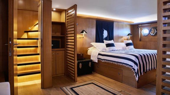Among motor yacht rental options in Athens Sounion II master cabin with bed and storage offers a comfortable onboard sta