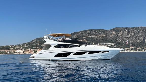 Among Nice yacht charter options Turquoise motor yacht shows smooth cruising and relaxing sea trip.