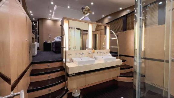 Among Mallorca yacht charter options Ycm120 shows spacious bathroom with double sink.