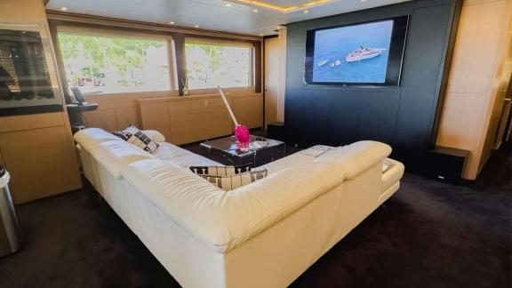 Among Mallorca yacht charter options Ycm120 shows salon with seating and entertainment area.