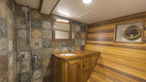 Warm and nostalgic atmosphere created by wooden finishes and patterned tiles.