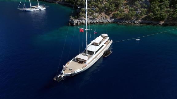 Anchored in Fethiye bay the 6 cabin 12 guest Dodo motorsailer shown from above ideal for yacht charter holiday.