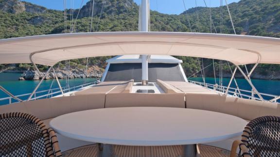 Anchored in Fethiye bay the 6 cabin 12 guest Dodo motorsailer featuring foredeck seating and sun area.