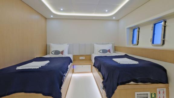 Among Fethiye luxury yacht options the 6 cabin 12 guest Dodo motorsailer features a twin cabin with two separate beds.
