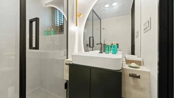 In Split motorsailer charter option Maxita bathroom with sink and shower cabin visible.