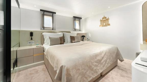 In Split motorsailer charter option Maxita cabin with large double bed and relaxation area visible.