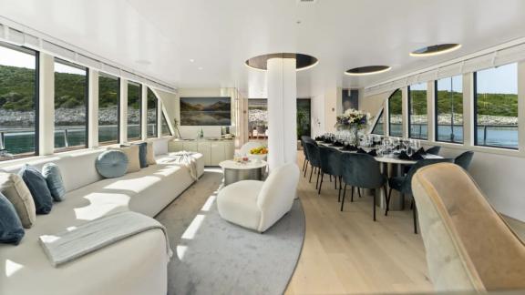 In Split motorsailer charter option Maxita interior salon with wide seating and dining table visible.