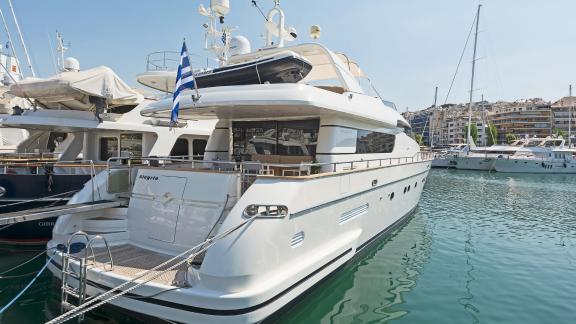 The elegant motor yacht Alegria in the harbor of Athens, ready for luxury charter experiences.