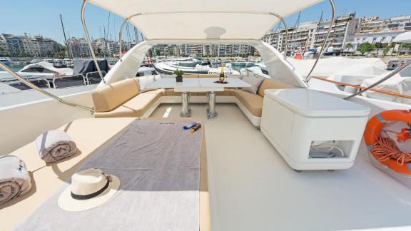 Relax on the flybridge of Alegria in Athens harbor with comfortable seating and a view.