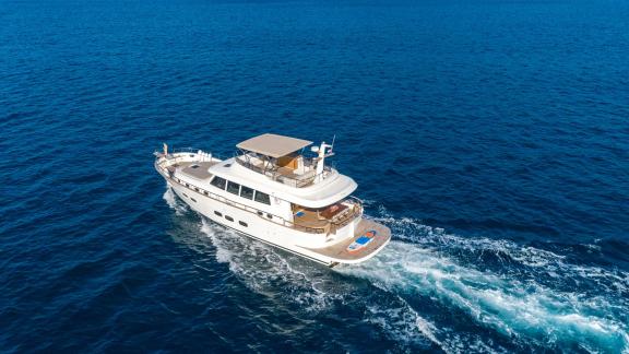 The Menorquin 68 FB motor yacht Cloud 9 sails calmly near Dubrovnik, offering elegance at sea.