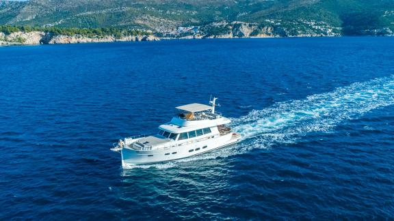 The Menorquin 68 FB motor yacht Cloud 9 glides powerfully off Dubrovnik, offering an exhilarating cruise experience.