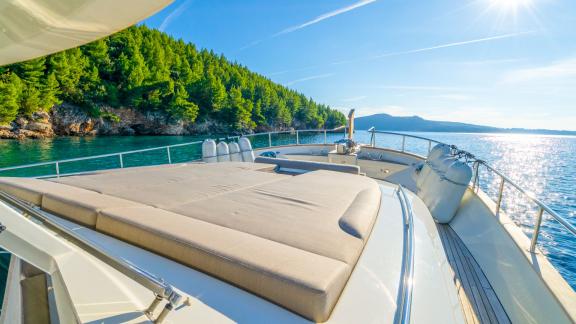 The Menorquin 68 FB motor yacht Cloud 9 offers a wide sun‑pad on the bow deck, ideal for lounging under the Croatian sun