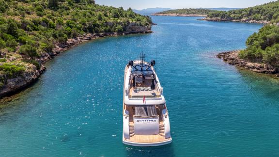 The Cynthia yacht, a Maiora 35DP model, cruises off Makarska's coast with sleek lines and striking elegance.