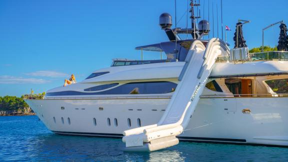 The Maiora 35DP yacht Cynthia features a large inflatable slide for fun at sea.