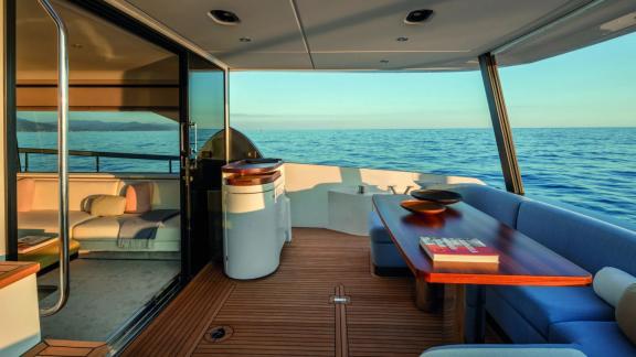 Dining table and seating area on the aft deck of the luxury motor yacht Donna