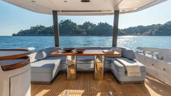 Aft deck dining table on the luxury motor yacht Donna