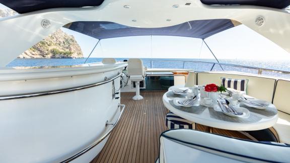 Ehthele’s flybridge features a bar and a dining area with sea view.