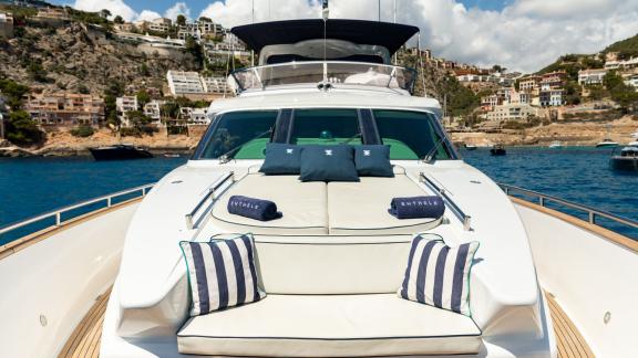 The bow lounge of Ehthele yacht offers sunbeds while anchored off Mallorca.