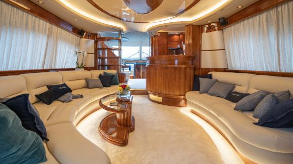 The spacious and comfortable living room of the yacht Estia Zeus with stylish decor and cozy seating areas.