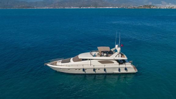 The Hurrem motor yacht is seen anchored in the blue sea.