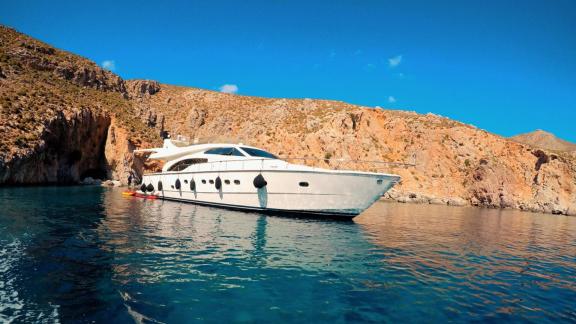 The motor yacht Mary is pictured anchored in a rocky cove in Greece.