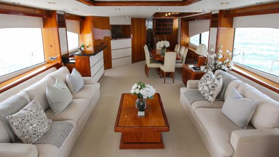 The spacious and stylish salon of the Notorious motor yacht adds comfort and luxury to your Dubai yacht rental experienc