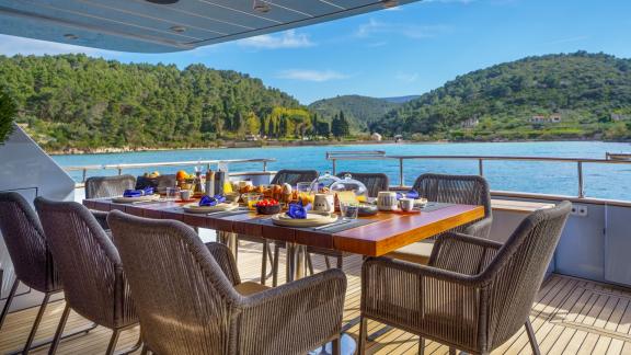 Superphantom 85's aft deck is perfect for open-air breakfasts with a scenic view.
