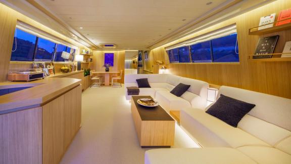 Superphantom 85's saloon features stylish seating and ample natural light for relaxing moments.