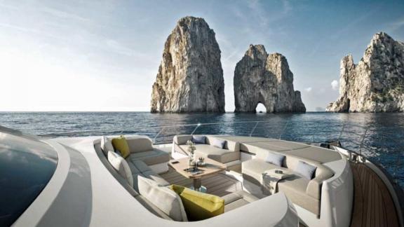 The cozy yacht lounge with a spectacular view of impressive rock formations in the sea.