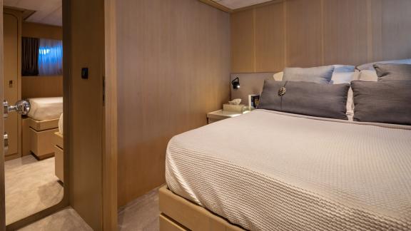 Relax in the modern double room of Motor Yacht Summer Fun with stylish decor and a comfortable bed.