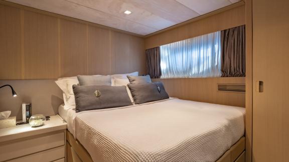 Cozy bedroom on Motor Yacht Summer Fun with a soft bed and stylish design for a restful sleep.