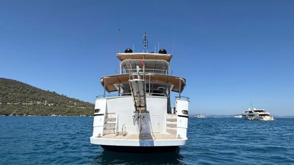 The stern view of Sveti Sky shows the swim platform and stairs with Bodrum bay in the background.