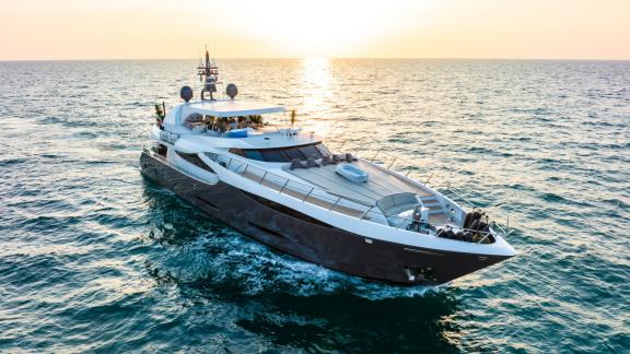 The Tatii 2 yacht offers a serene yacht rental experience on Dubai's enchanting waters at sunset.