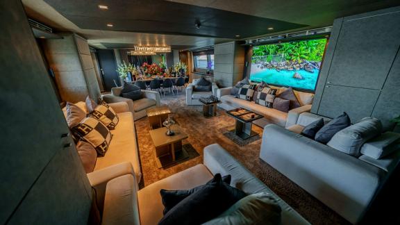 The spacious lounge of Tatii 2 delivers a luxurious yacht rental experience in Dubai with its elegant design.