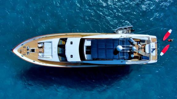 Motor yacht Riva 21 seen from above, floating on the blue sea.