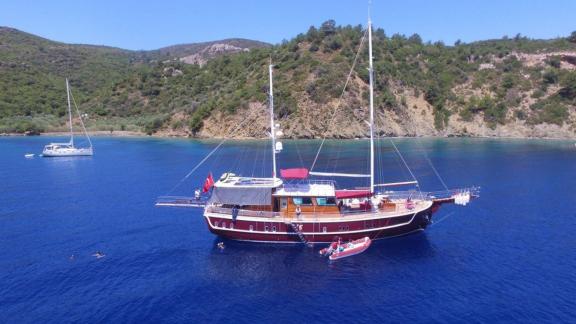 A luxurious gulet with 6 cabins anchored in the clear waters of Göcek, Turkey.