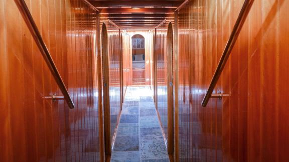 Explore the stylishly designed corridor of Gulet Myra with high-quality wood paneling.