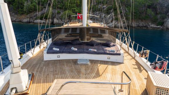 Comfortable sun loungers on the deck of a 5-cabin motor yacht in Fethiye, ideal for relaxing and enjoying the view.