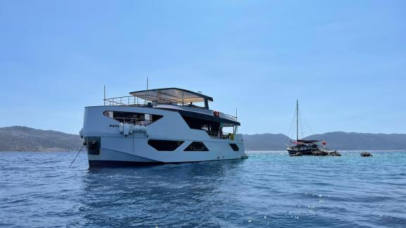 Luxury trawler Nayk 3 anchored in Göcek, offering a serene sea view.