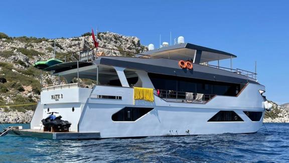 Luxury trawler Nayk 3 anchored in Göcek, offering a serene sea view.